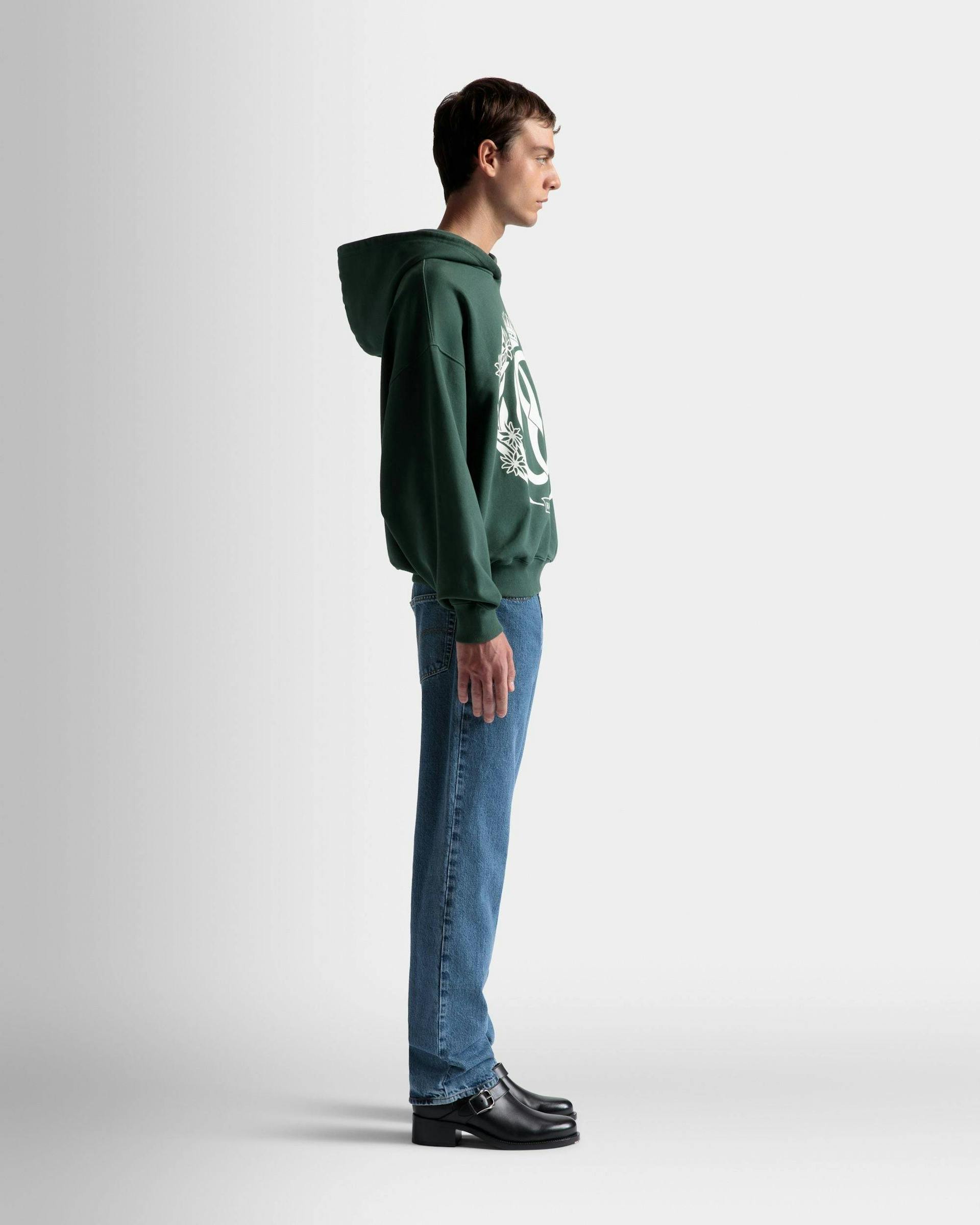 Men's Foiled Hooded Sweatshirt In Kelly Green Cotton | Bally | On Model 3/4 Front